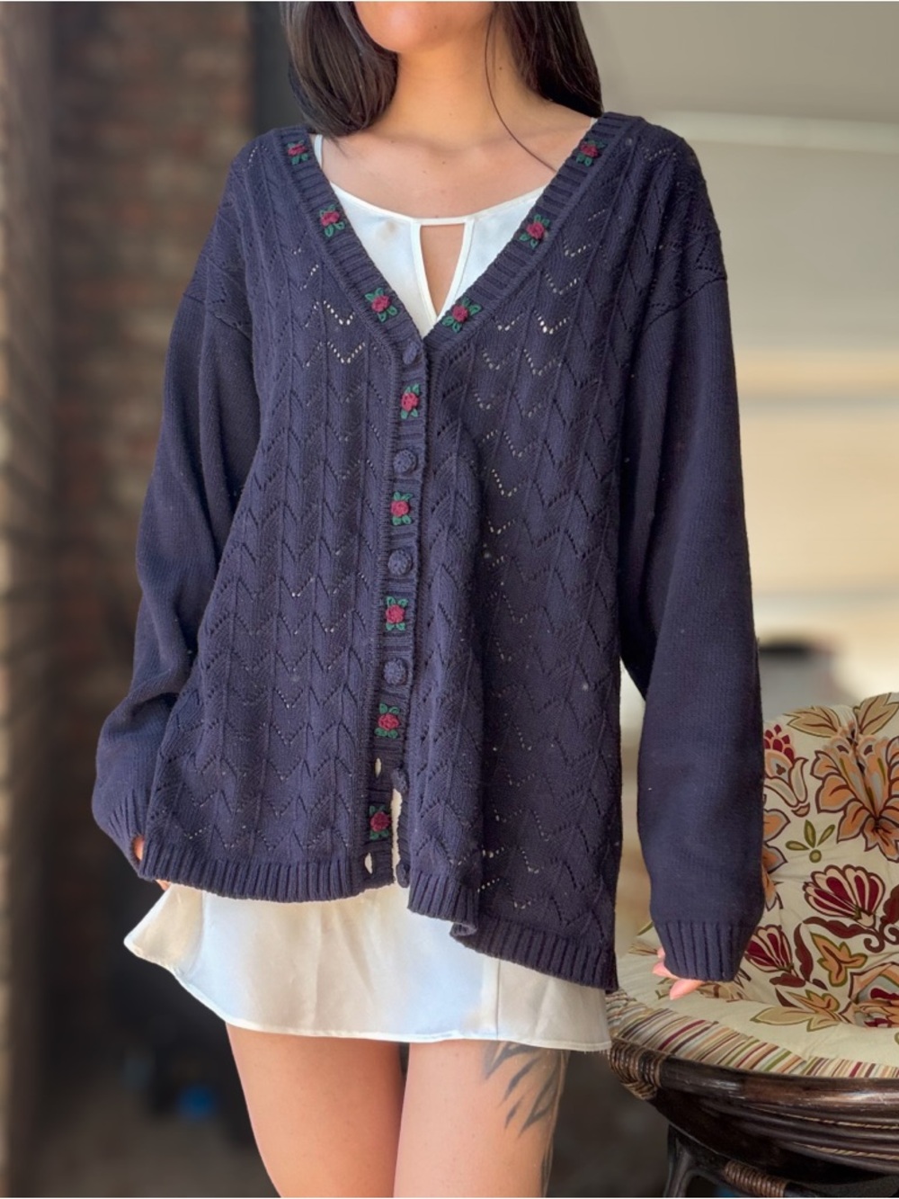 Dainty navy knit sweater with diamond pattern and cotton rose embroidered trim
